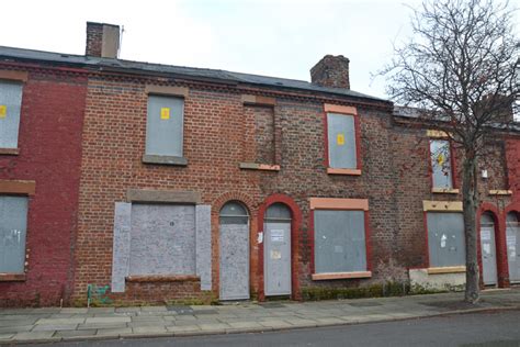 house boarded up with metal|why is a house boarding up.